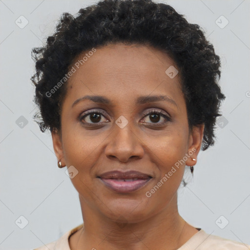 Joyful black adult female with short  brown hair and brown eyes