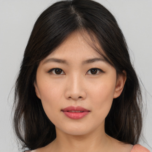 Neutral asian young-adult female with medium  brown hair and brown eyes