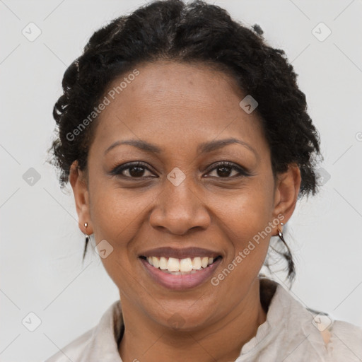 Joyful black adult female with short  brown hair and brown eyes