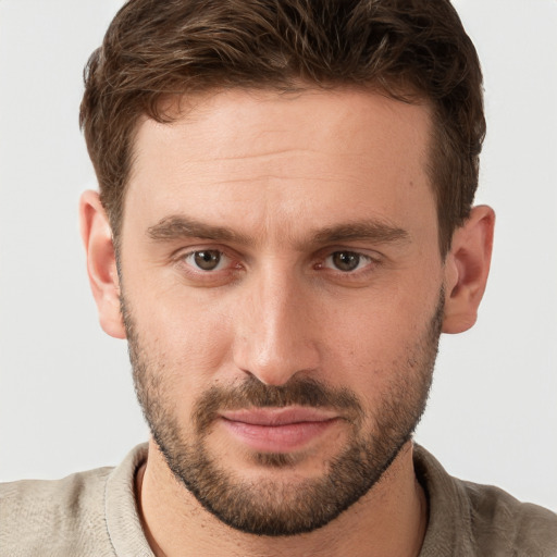 Joyful white young-adult male with short  brown hair and grey eyes