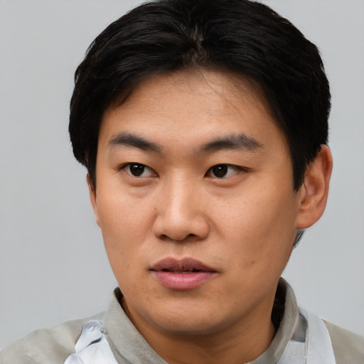 Neutral asian young-adult male with short  black hair and brown eyes