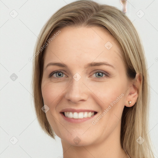 Joyful white young-adult female with long  brown hair and grey eyes