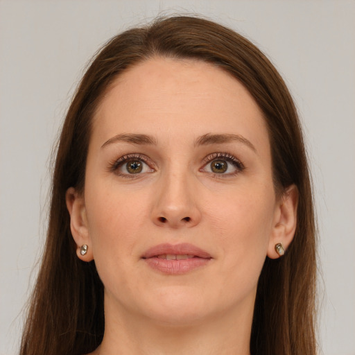 Joyful white young-adult female with long  brown hair and grey eyes