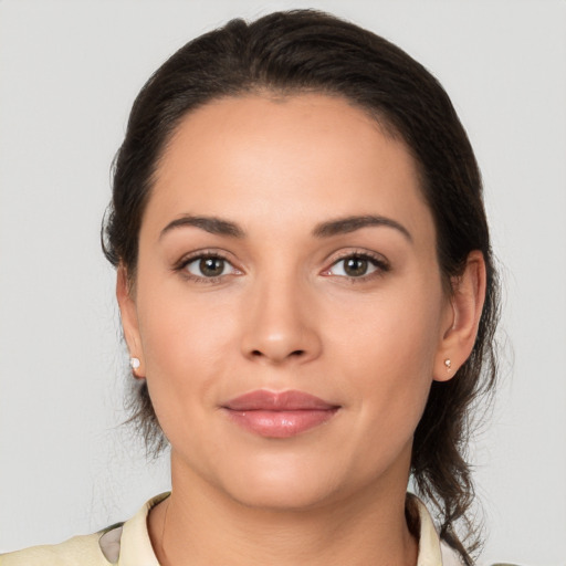 Joyful white young-adult female with medium  brown hair and brown eyes