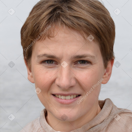 Joyful white young-adult female with short  brown hair and grey eyes