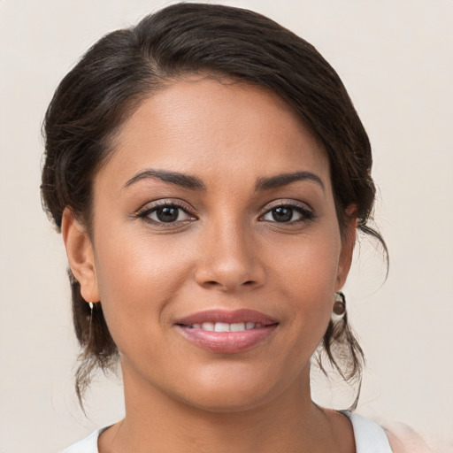 Joyful white young-adult female with medium  brown hair and brown eyes