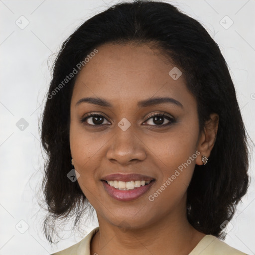 Joyful black young-adult female with long  brown hair and brown eyes