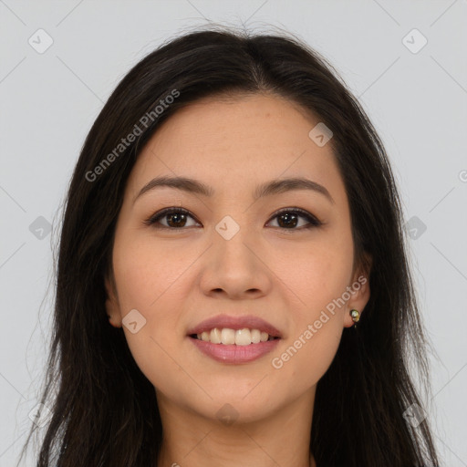 Joyful latino young-adult female with long  brown hair and brown eyes