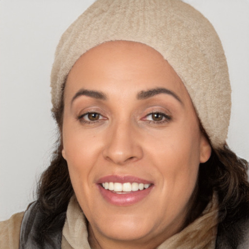 Joyful white young-adult female with long  black hair and brown eyes