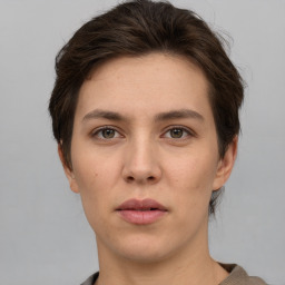 Neutral white young-adult female with short  brown hair and brown eyes