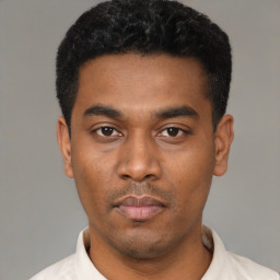 Neutral latino young-adult male with short  black hair and brown eyes