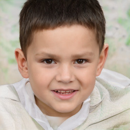 Joyful white child male with short  brown hair and brown eyes