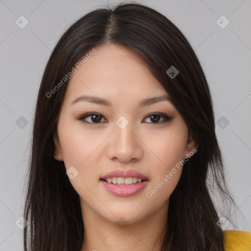 Joyful asian young-adult female with long  brown hair and brown eyes