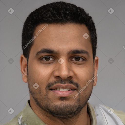 Joyful latino young-adult male with short  brown hair and brown eyes