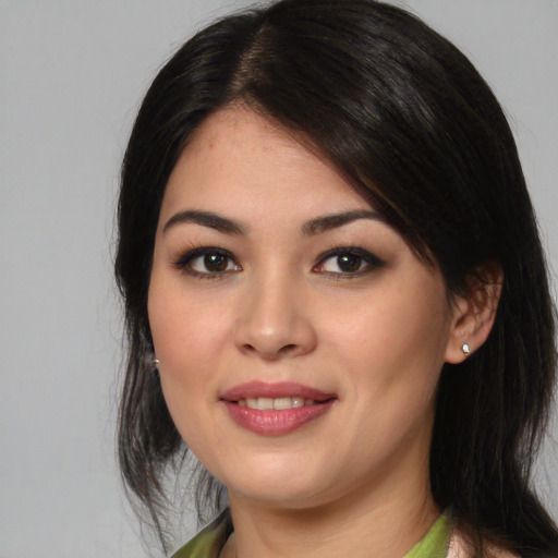 Joyful latino young-adult female with medium  black hair and brown eyes