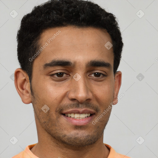 Joyful latino young-adult male with short  black hair and brown eyes