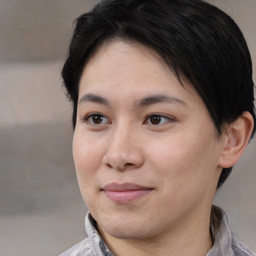 Joyful white young-adult female with medium  black hair and brown eyes