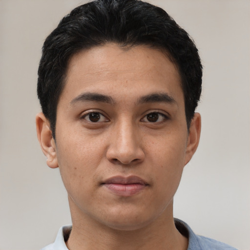 Joyful asian young-adult male with short  brown hair and brown eyes
