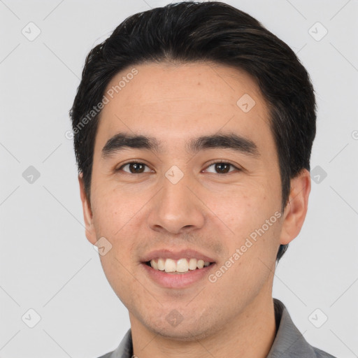 Joyful white young-adult male with short  black hair and brown eyes