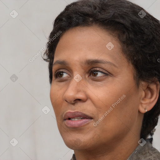 Joyful white adult female with short  brown hair and brown eyes