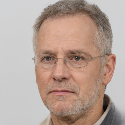 Neutral white middle-aged male with short  gray hair and brown eyes