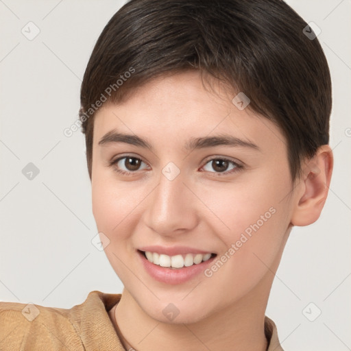 Joyful white young-adult female with short  brown hair and brown eyes