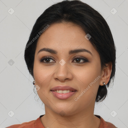 Joyful latino young-adult female with medium  black hair and brown eyes