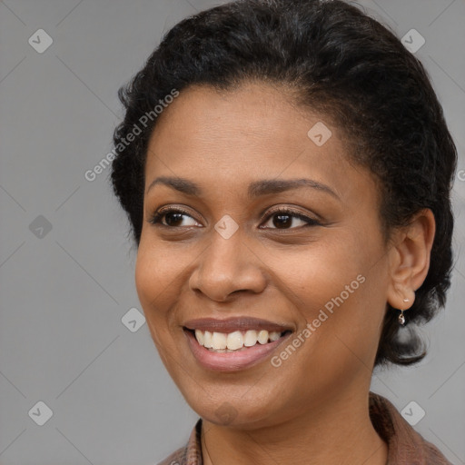 Joyful black young-adult female with short  brown hair and brown eyes