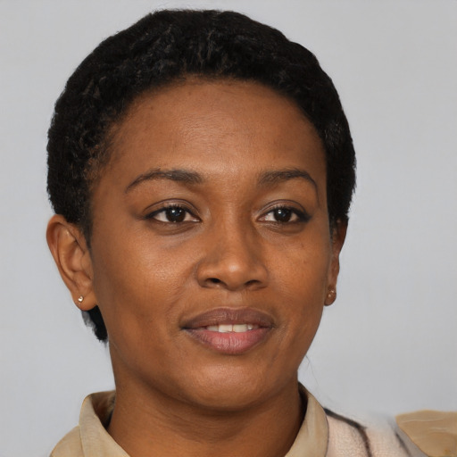 Joyful latino young-adult female with short  black hair and brown eyes