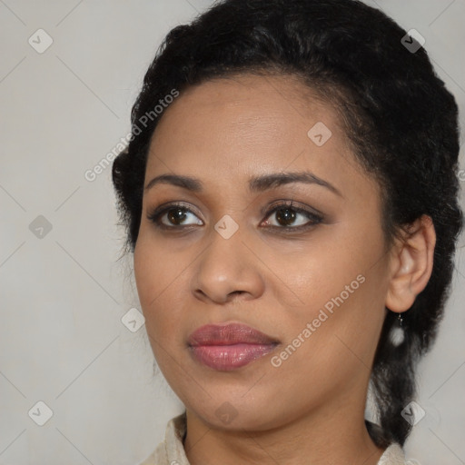 Joyful black young-adult female with medium  black hair and brown eyes