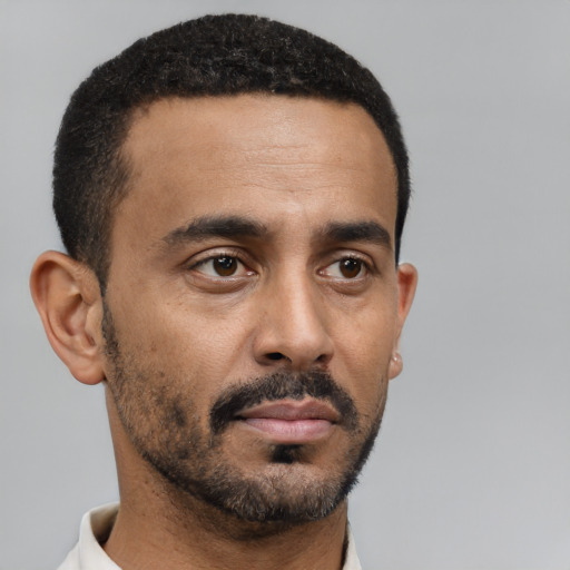 Neutral black young-adult male with short  black hair and brown eyes