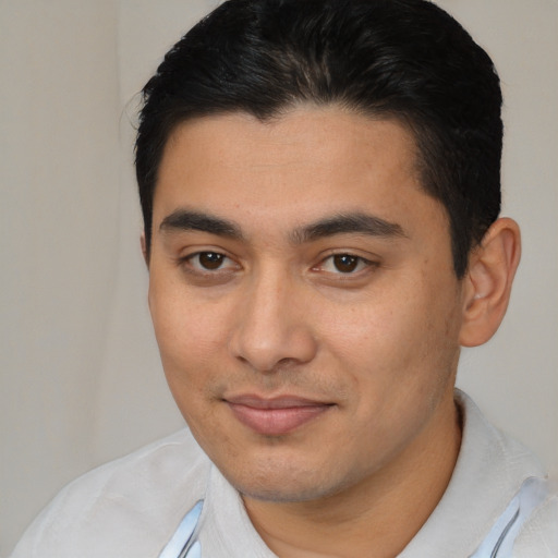 Joyful latino young-adult male with short  brown hair and brown eyes