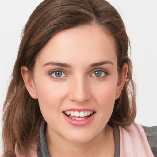 Joyful white young-adult female with long  brown hair and blue eyes