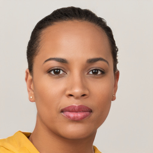 Joyful latino young-adult female with short  brown hair and brown eyes