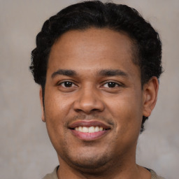 Joyful latino young-adult male with short  brown hair and brown eyes