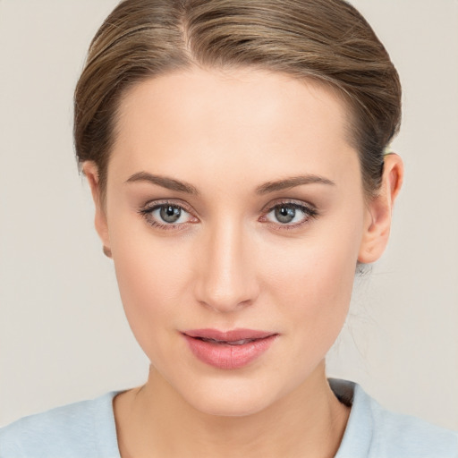 Joyful white young-adult female with medium  brown hair and blue eyes