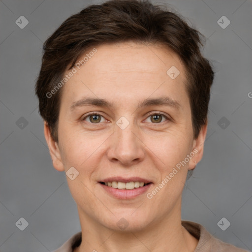 Joyful white adult female with short  brown hair and grey eyes