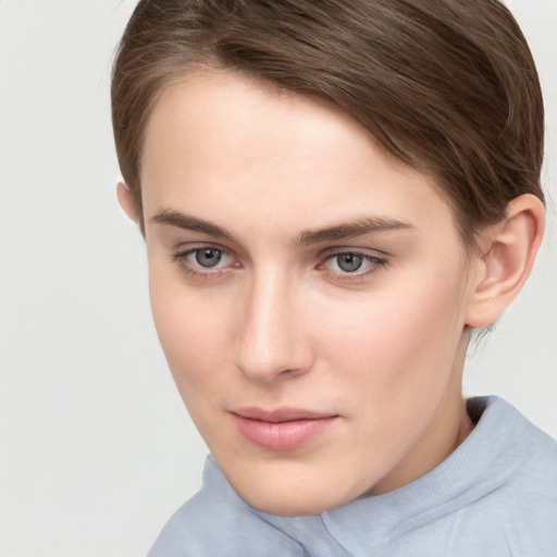 Neutral white young-adult female with short  brown hair and brown eyes