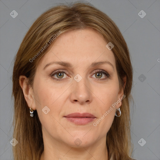 Joyful white adult female with long  brown hair and grey eyes