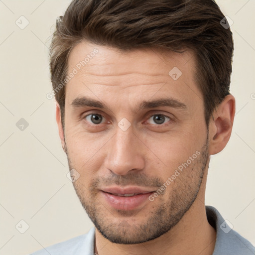 Joyful white young-adult male with short  brown hair and brown eyes