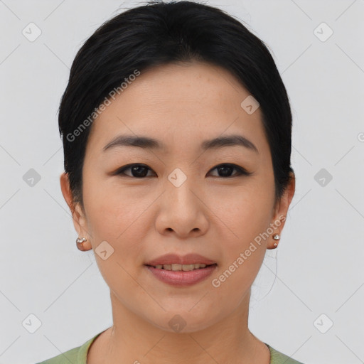 Joyful asian young-adult female with short  brown hair and brown eyes