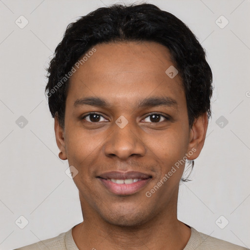 Joyful black young-adult male with short  black hair and brown eyes