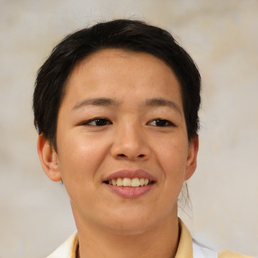 Joyful asian young-adult female with short  brown hair and brown eyes