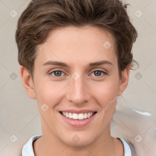 Joyful white young-adult female with short  brown hair and grey eyes