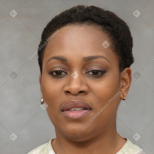 Joyful black young-adult female with short  brown hair and brown eyes