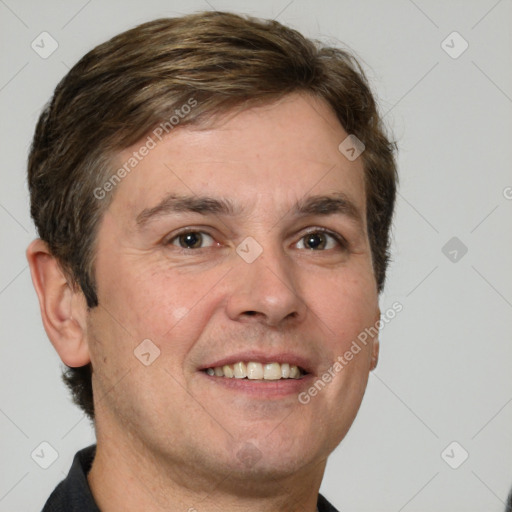 Joyful white adult male with short  brown hair and grey eyes