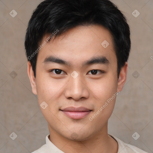 Joyful asian young-adult male with short  black hair and brown eyes