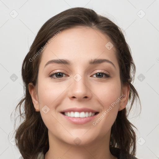 Joyful white young-adult female with medium  brown hair and grey eyes