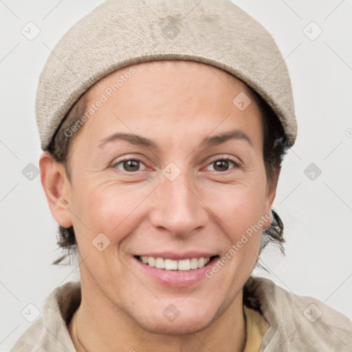 Joyful white adult female with short  brown hair and grey eyes