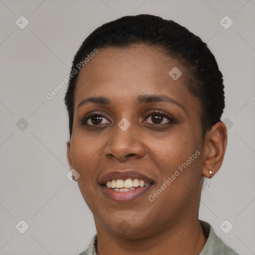 Joyful black young-adult female with short  black hair and brown eyes